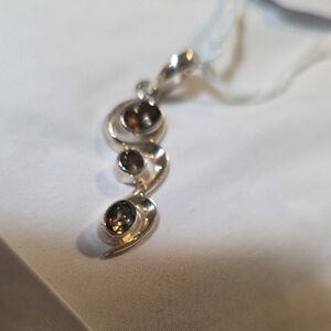 Sterling Silver And Smokey Quartz.